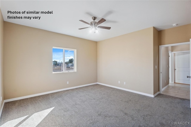 unfurnished room featuring carpet, ceiling fan, and baseboards