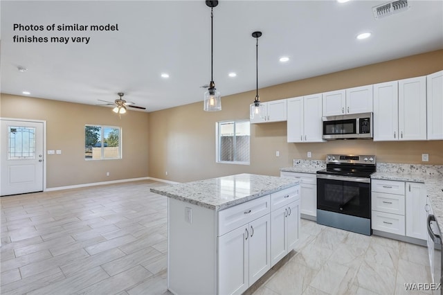 kitchen featuring appliances with stainless steel finishes, visible vents, ceiling fan, and white cabinets
