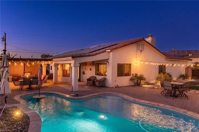 view of pool with a fenced in pool and a patio