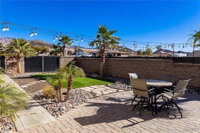 view of patio featuring outdoor dining area and a fenced backyard