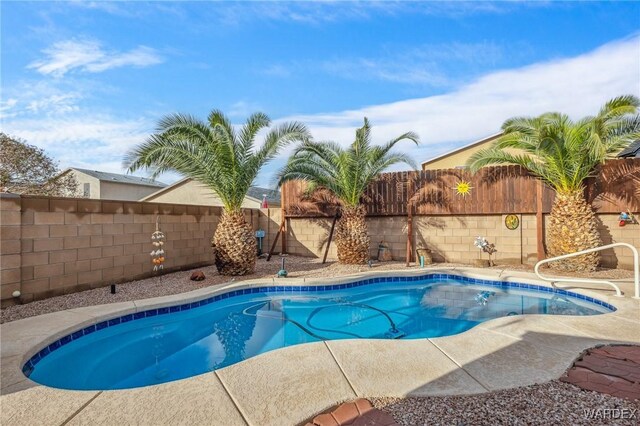 view of swimming pool featuring a fenced backyard and a fenced in pool