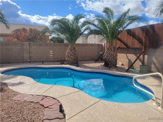 view of swimming pool with a fenced backyard and a fenced in pool