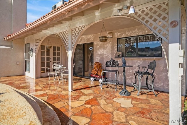 view of patio featuring french doors