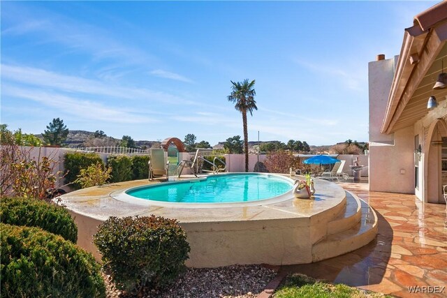 view of swimming pool with a fenced in pool, a patio area, and a fenced backyard