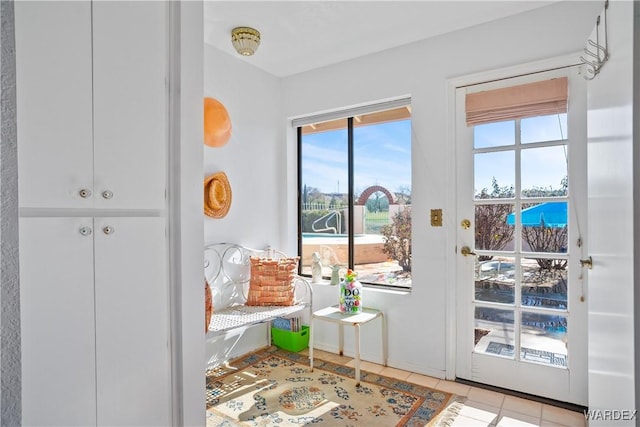 doorway featuring light tile patterned floors