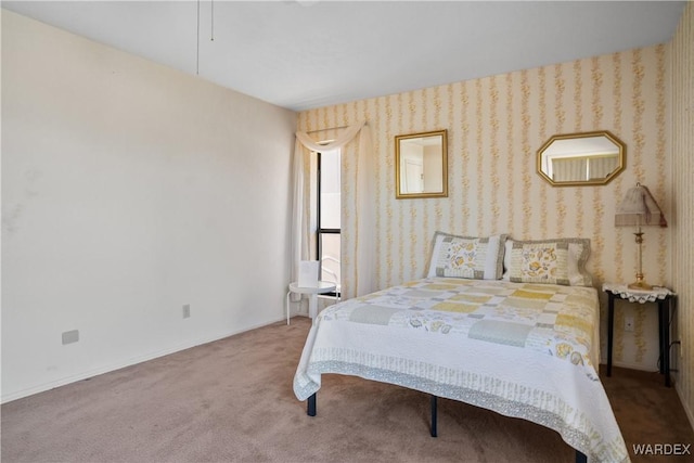 bedroom featuring baseboards, carpet floors, and wallpapered walls