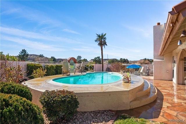 view of swimming pool featuring a fenced in pool, a patio area, and a fenced backyard