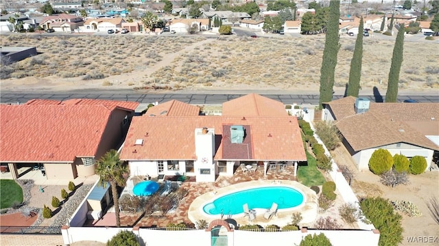 birds eye view of property with a residential view