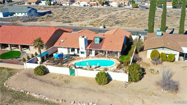 view of pool featuring a fenced front yard and a residential view