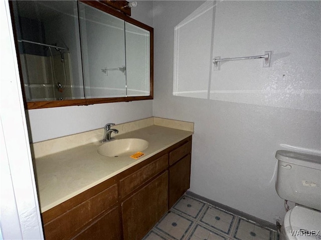 full bathroom with vanity, toilet, and tile patterned floors