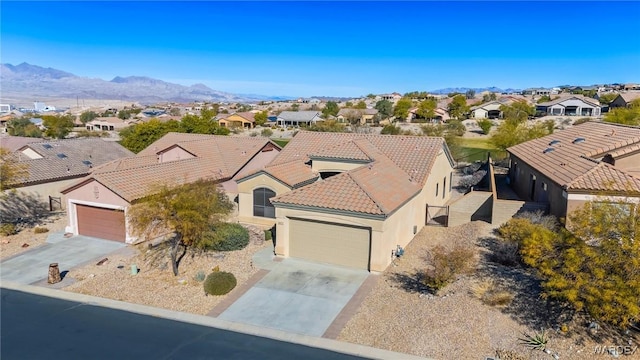 birds eye view of property featuring a residential view and a mountain view