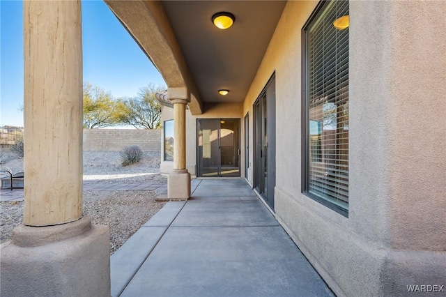 view of patio featuring fence