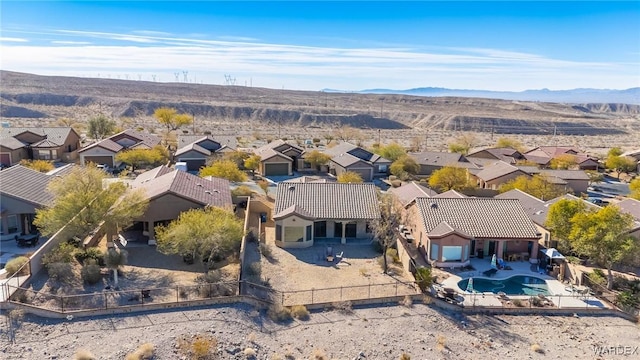 drone / aerial view with a residential view and a mountain view