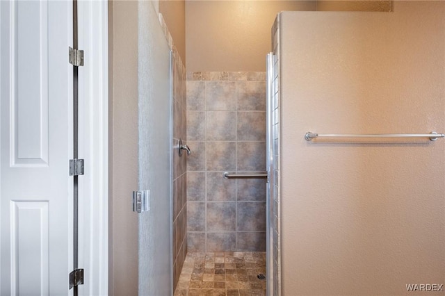 bathroom featuring a stall shower