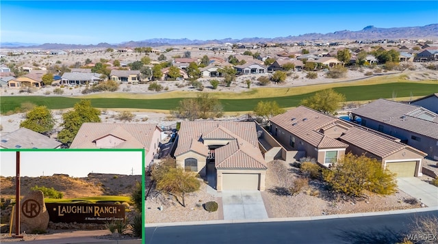 birds eye view of property with a residential view and a mountain view