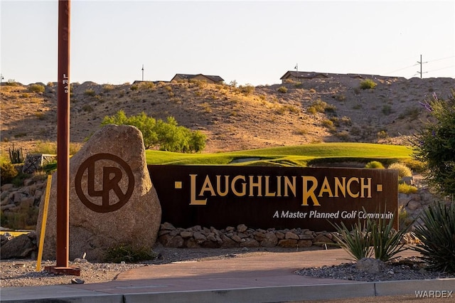 community sign featuring a mountain view