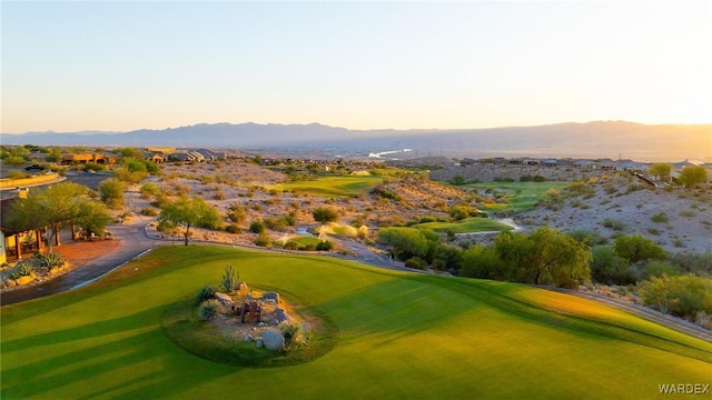 view of property's community featuring view of golf course and a mountain view