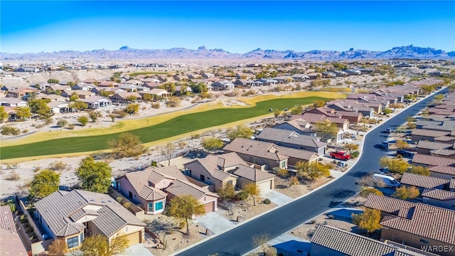 bird's eye view with view of golf course, a residential view, and a mountain view