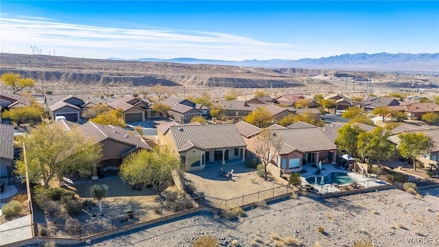 birds eye view of property featuring a residential view and a mountain view