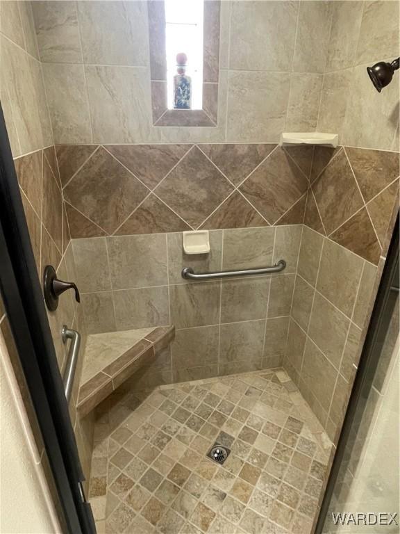 bathroom with a shower stall