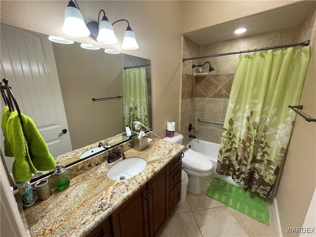 full bathroom with toilet, tile patterned floors, shower / bath combo, and vanity