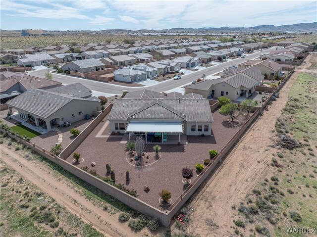 drone / aerial view featuring a residential view and a mountain view