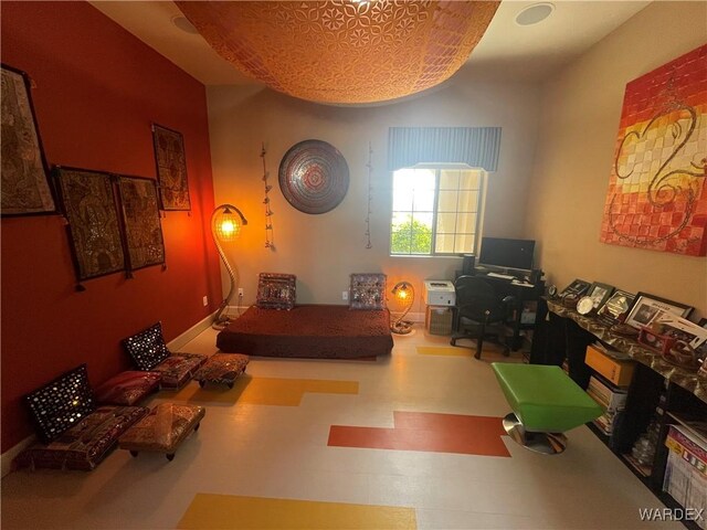 bedroom with tile patterned floors and baseboards