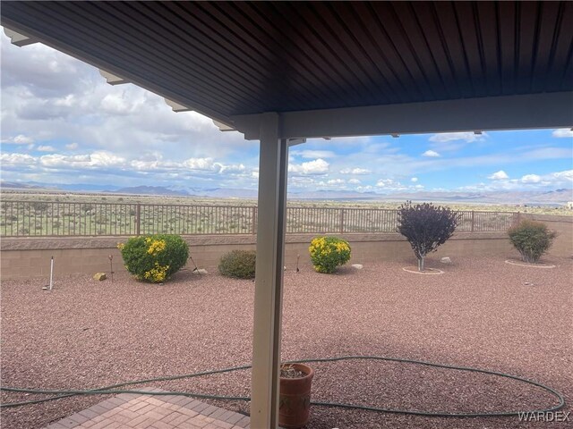 view of yard featuring a patio area and a fenced backyard