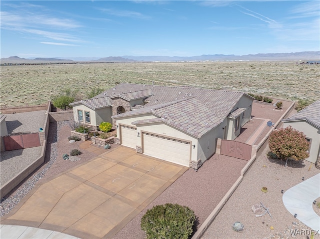 drone / aerial view featuring a mountain view