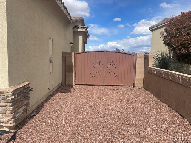 view of gate featuring fence