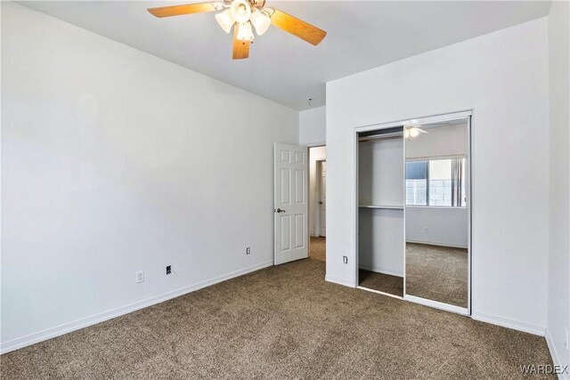 unfurnished bedroom featuring a ceiling fan, carpet, baseboards, and a closet