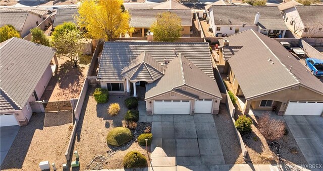 birds eye view of property with a residential view