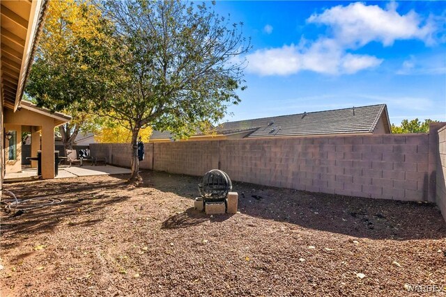 view of yard featuring a patio and a fenced backyard