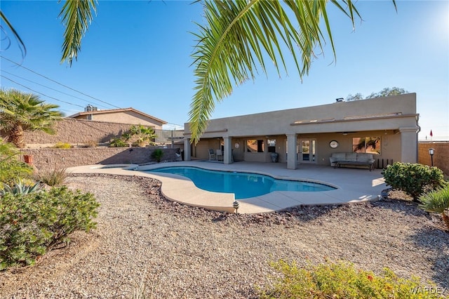 view of swimming pool with a patio area, a fenced backyard, and a fenced in pool