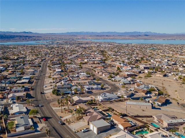 birds eye view of property with a residential view and a water and mountain view