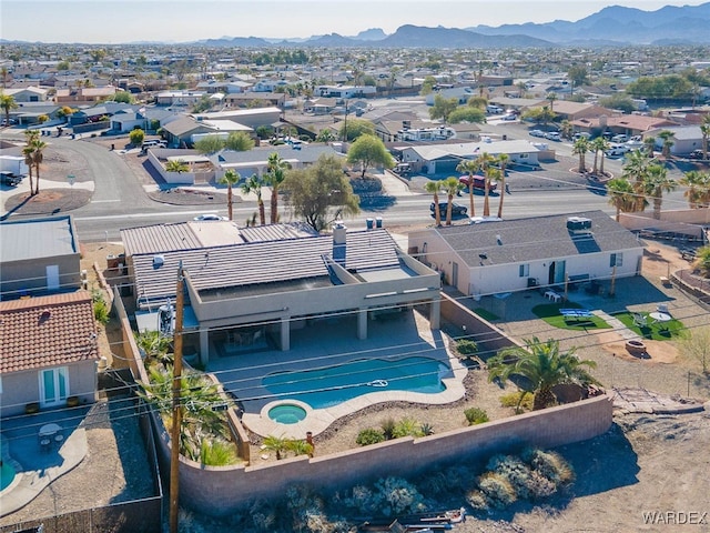 drone / aerial view with a residential view and a mountain view