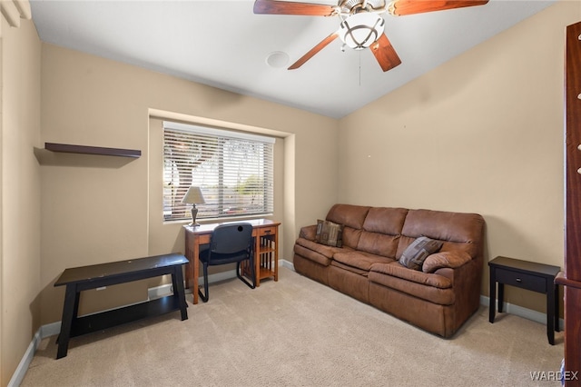 office featuring baseboards, ceiling fan, lofted ceiling, and light colored carpet