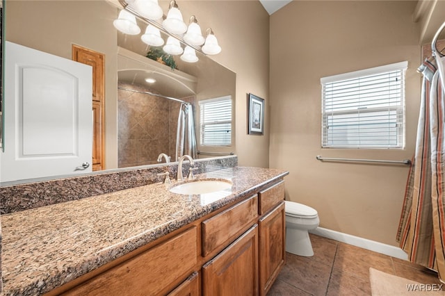 bathroom with toilet, tile patterned flooring, baseboards, and vanity