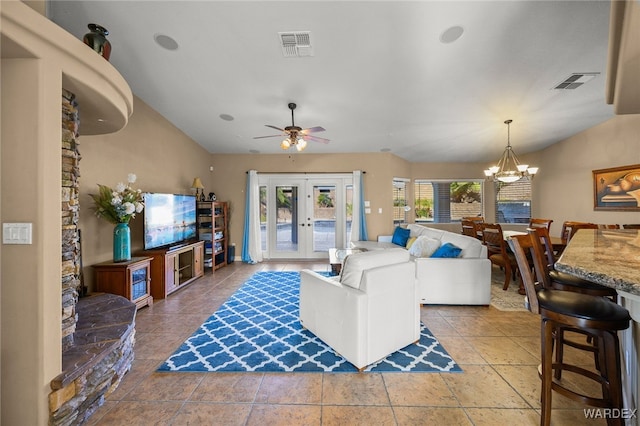 living area featuring lofted ceiling, french doors, visible vents, and ceiling fan with notable chandelier