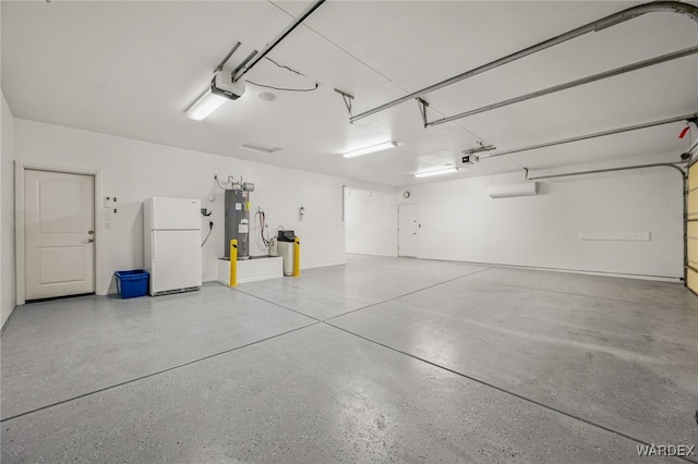 garage with water heater, freestanding refrigerator, and a garage door opener