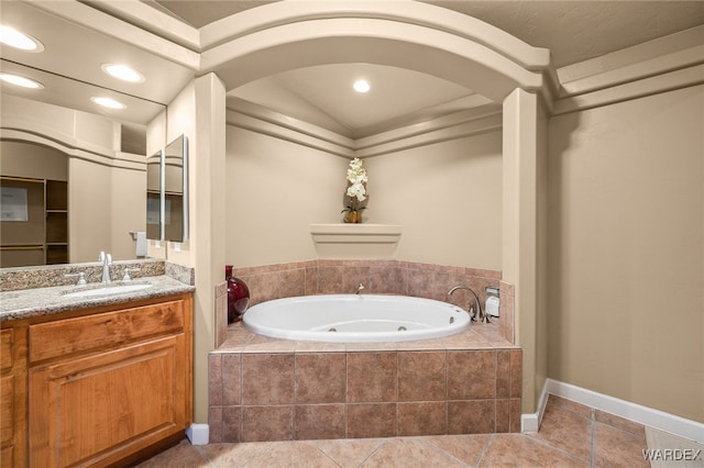 bathroom featuring a jetted tub, tile patterned flooring, recessed lighting, and vanity