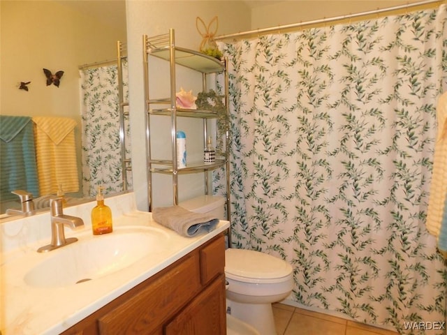 bathroom featuring toilet, curtained shower, tile patterned flooring, and vanity