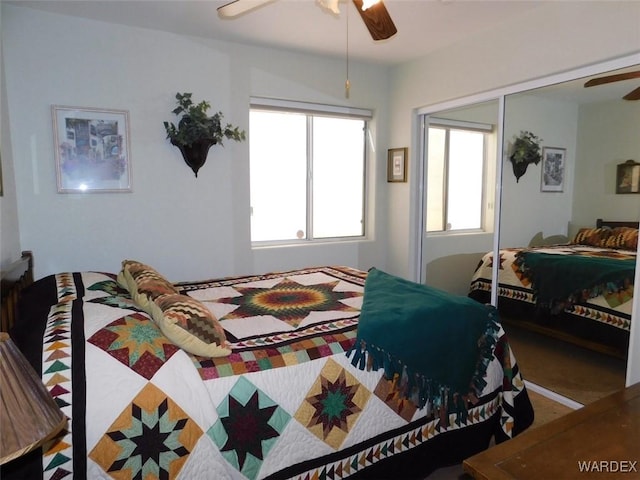 bedroom with a ceiling fan and a closet