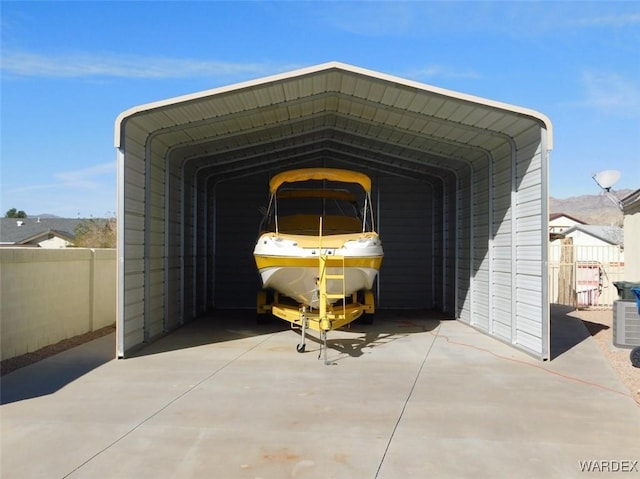 exterior space featuring fence and a carport