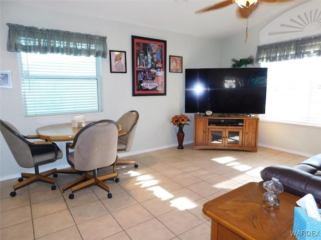 dining room featuring plenty of natural light, baseboards, and light tile patterned floors