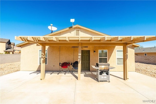 back of property featuring a patio area, fence, and stucco siding