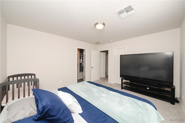 bedroom featuring carpet flooring and visible vents