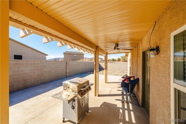 view of patio featuring a fenced backyard and a grill