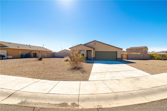 view of front of house with a garage, fence, concrete driveway, and stucco siding