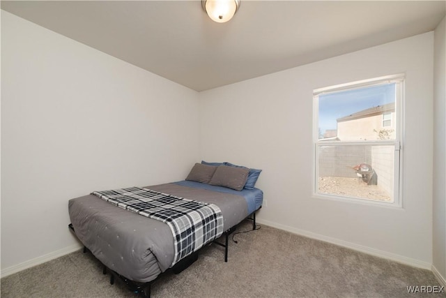 carpeted bedroom with baseboards